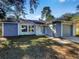 Newly remodeled home with a gray garage door and stone accents at 511 Cloudcroft Dr, Deltona, FL 32738