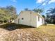 House exterior showcasing a side view with a new coat of paint at 511 Cloudcroft Dr, Deltona, FL 32738