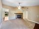 Bright living room with fireplace and view into another room at 511 Cloudcroft Dr, Deltona, FL 32738