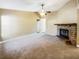 Spacious living room featuring a brick fireplace and ceiling fan at 511 Cloudcroft Dr, Deltona, FL 32738