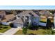 Two-story house aerial view showing the house and surrounding neighborhood at 5417 Calla Lily Ct, Kissimmee, FL 34758