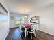 Bright dining room features a farmhouse table and storage at 5417 Calla Lily Ct, Kissimmee, FL 34758