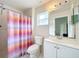 Bathroom with shower/tub combo, toilet and white vanity at 5633 Piney Ridge Dr, Orlando, FL 32808