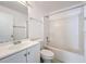 Bathroom with white vanity, bathtub, and a large mirror at 5633 Piney Ridge Dr, Orlando, FL 32808