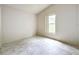 Bright bedroom with large window and marble-look flooring at 5633 Piney Ridge Dr, Orlando, FL 32808