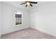 Bright bedroom with carpeted floor, large closet, and window at 58 Bonita Rd, Debary, FL 32713