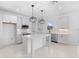 Modern kitchen with white cabinets, quartz countertops and island at 58 Bonita Rd, Debary, FL 32713