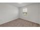 Bright bedroom with carpeted floor and window at 5912 Piney Shrub Pl, Saint Cloud, FL 34771