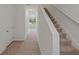 Carpeted staircase leading to the second floor at 5912 Piney Shrub Pl, Saint Cloud, FL 34771