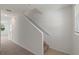 View of a carpeted staircase from the hallway at 5912 Piney Shrub Pl, Saint Cloud, FL 34771