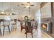 Bright dining area with fireplace and view to lanai at 5942 Nw 26Th Ln, Ocala, FL 34482