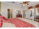 Main bedroom with access to bathroom and sunroom at 5942 Nw 26Th Ln, Ocala, FL 34482