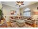 Sitting room with leather sofas, a zebra print rug, and hardwood floors at 5942 Nw 26Th Ln, Ocala, FL 34482