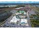 Aerial view of community amenities, including pools and clubhouse at 597 Lost Shaker Way, Daytona Beach, FL 32124