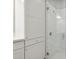 Bathroom features a large shower and linen storage at 597 Lost Shaker Way, Daytona Beach, FL 32124