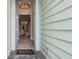 Open front door revealing a bright interior hallway at 597 Lost Shaker Way, Daytona Beach, FL 32124