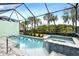 Inviting screened pool and spa with paver deck at 597 Lost Shaker Way, Daytona Beach, FL 32124