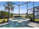 Screened spa with tranquil water feature at 597 Lost Shaker Way, Daytona Beach, FL 32124