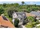 Aerial view of two-story house, landscaping, and neighborhood at 605 Brightview Dr, Lake Mary, FL 32746