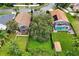 Aerial view showing three homes with pools and lush landscaping at 605 Brightview Dr, Lake Mary, FL 32746