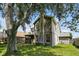 Backyard with large tree and grassy area at 605 Brightview Dr, Lake Mary, FL 32746