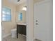 Small bathroom with toilet, sink, and built-in vanity at 605 Brightview Dr, Lake Mary, FL 32746