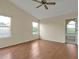 Bright bedroom featuring wood floors, vaulted ceiling and en-suite bathroom at 605 Brightview Dr, Lake Mary, FL 32746