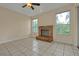 Gathering room with fireplace and tile flooring at 605 Brightview Dr, Lake Mary, FL 32746