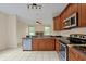 Kitchen features granite countertops and wood cabinets at 605 Brightview Dr, Lake Mary, FL 32746