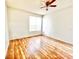 Spacious bedroom with hardwood floors and large window at 6356 Raleigh St # 1503, Orlando, FL 32835