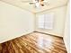 Bright bedroom with hardwood floors and window at 6356 Raleigh St # 1503, Orlando, FL 32835