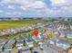 An aerial shot showcasing a home with a red locator pin in a beautiful community near the city at 6921 Arnoldson St, Orlando, FL 32827