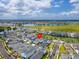 Aerial view of a home with a red locator pin in a serene community near a lake and green spaces at 6921 Arnoldson St, Orlando, FL 32827