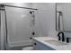 Clean bathroom with white subway tiles, bathtub, and modern vanity at 6921 Arnoldson St, Orlando, FL 32827