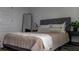 Spacious bedroom with a comfortable bed and neutral color scheme at 6921 Arnoldson St, Orlando, FL 32827