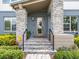 Front entrance with stone pillars and a covered porch at 6921 Arnoldson St, Orlando, FL 32827