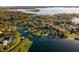 Wide view of neighborhood and lakefront home at 7 1 St Ct, Windermere, FL 34786