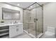 Clean bathroom with a walk-in shower and modern vanity at 7 1 St Ct, Windermere, FL 34786