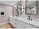 Elegant bathroom with double vanity, quartz countertops, and black accents at 7 1 St Ct, Windermere, FL 34786