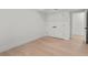 Empty bedroom with hardwood floors and white walls at 7 1 St Ct, Windermere, FL 34786