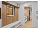 Modern laundry room with built-in bench and storage at 7 1 St Ct, Windermere, FL 34786