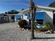 Quaint Florida home with blue shutters and a gravel yard at 71 Brooks Dr, Ormond Beach, FL 32176