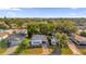 Aerial view showcasing a single-Gathering home with a driveway and surrounding landscape at 712 Jason Dr, Lady Lake, FL 32159