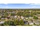 Aerial view of residential neighborhood featuring various house styles and tree-lined streets at 712 Jason Dr, Lady Lake, FL 32159