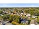 Aerial view of a large community with numerous homes and lush landscaping at 712 Jason Dr, Lady Lake, FL 32159