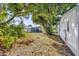 Landscaped backyard with mature trees at 712 Jason Dr, Lady Lake, FL 32159