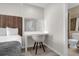 Bedroom with a desk, chair, and view of the bathroom at 7383 Universal Blvd # 207, Orlando, FL 32819