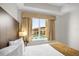 Bedroom with pool view and comfortable bedding at 7383 Universal Blvd # 207, Orlando, FL 32819