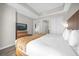 Comfortable bedroom features a king-size bed, TV, and ample closet space at 7383 Universal Blvd # 207, Orlando, FL 32819