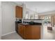 Convenient kitchenette with black countertops overlooking a pool view at 7383 Universal Blvd # 207, Orlando, FL 32819